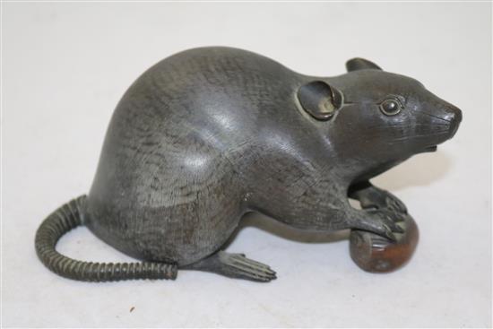 A Japanese bronze model of a rat holding a nut, late 19th century, length 17cm, loss to tail